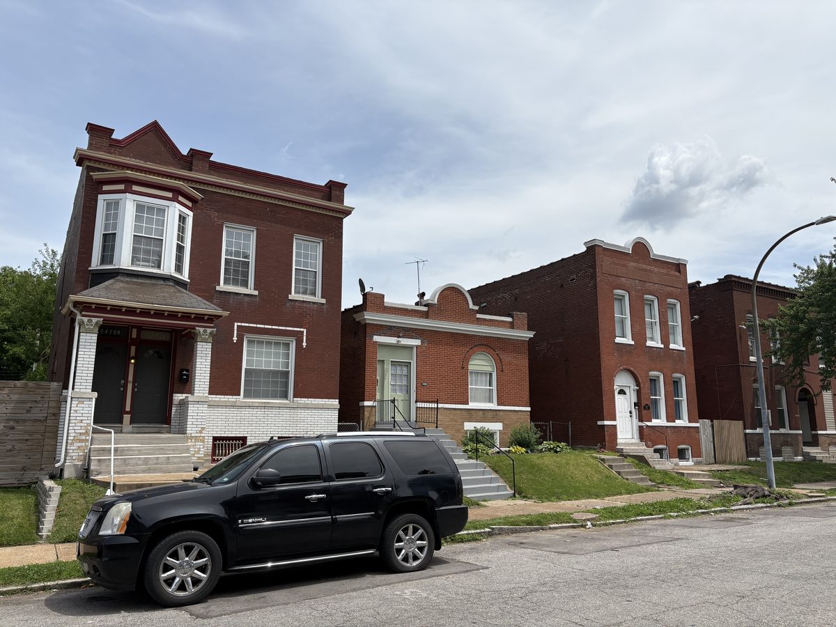 Benton Park St. Louis homes — renovated brick 1.5-story with mansard dormers beside original red brick flat, Tennessee Avenue, 63104