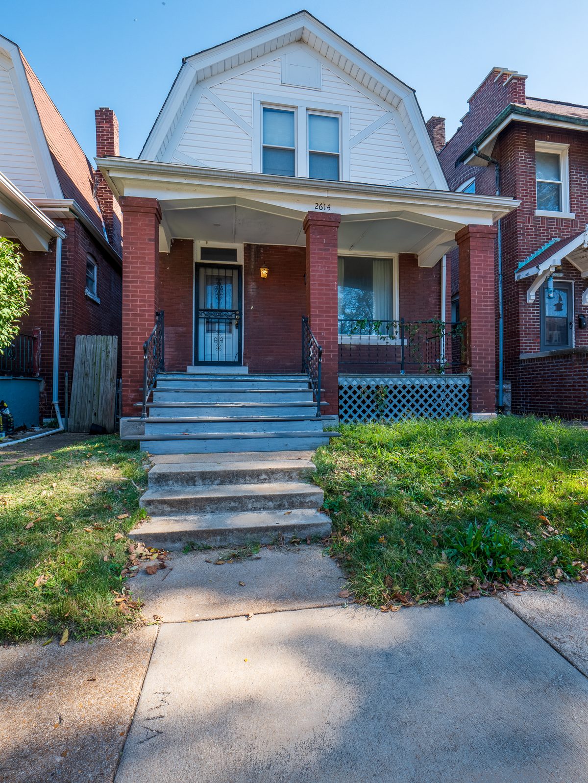 Fox Park St. Louis homes for sale — 1.5-story brick home with gambrel roof and covered front porch at 2614, the South City housing stock buyers find in 63104 Fox Park