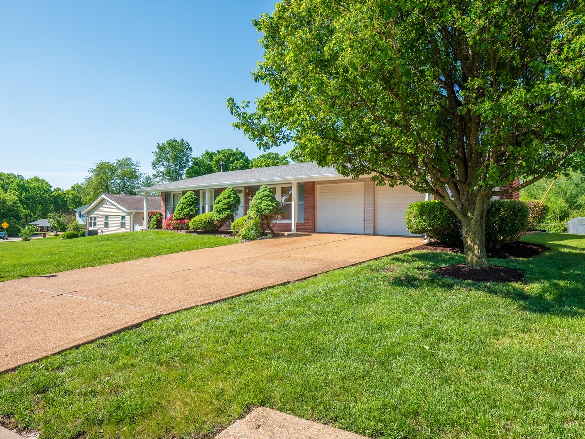 Mehlville MO homes for sale — brick ranch with attached garage and manicured landscaping, representative of the move-in ready housing stock available in 63128 South County