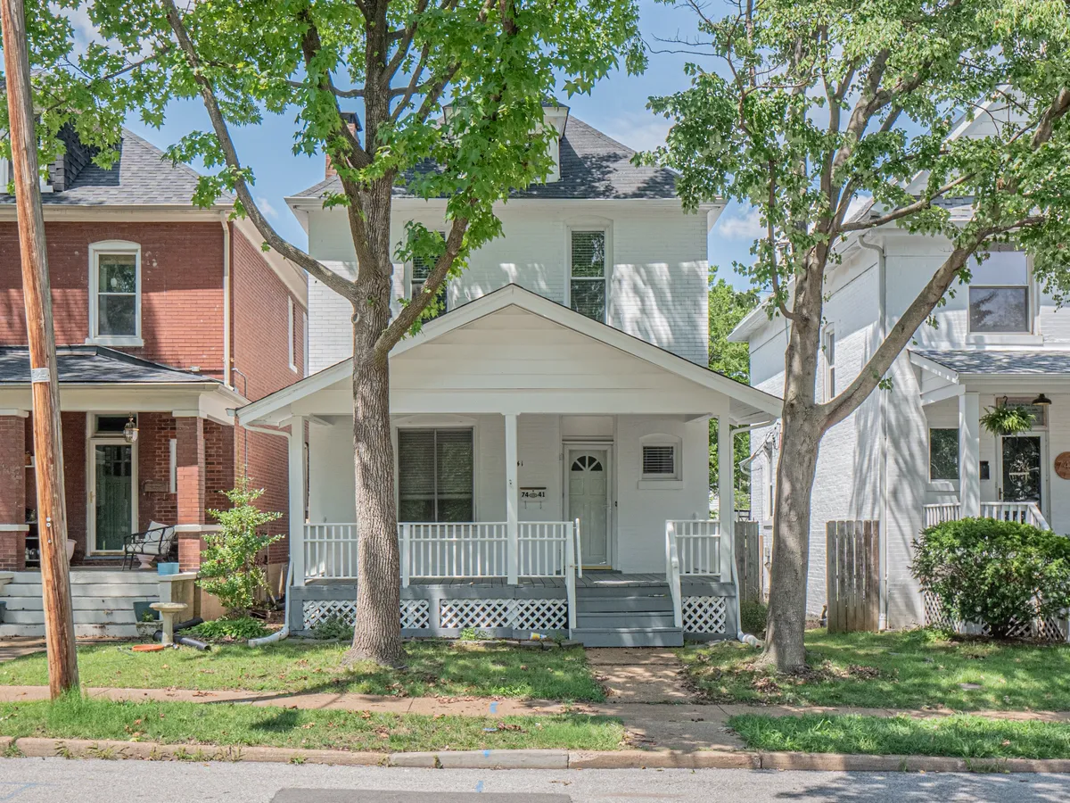 A white brick two-story home with a covered front porch in Maplewood, one of the inner-ring St.&nbsp;Louis suburbs