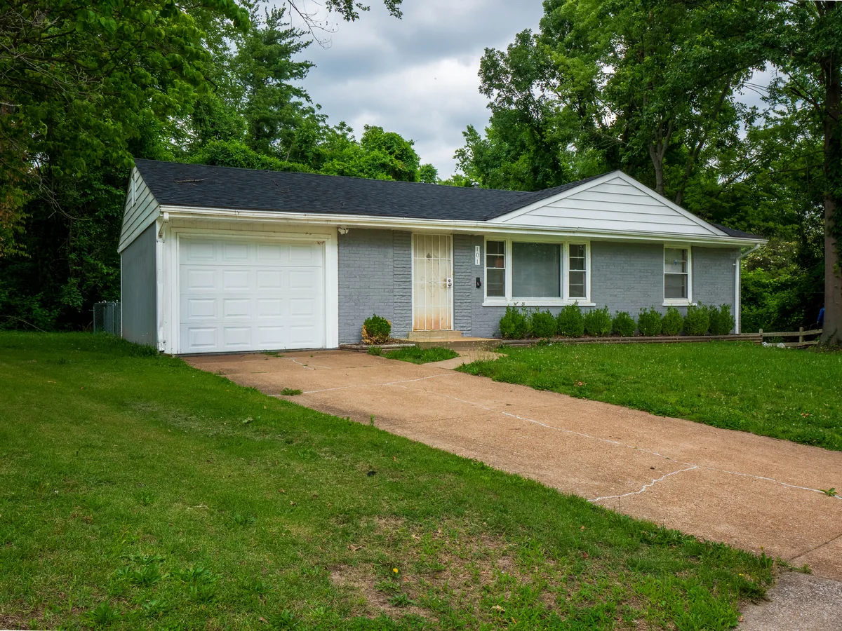 Ranch exterior — 2-car garage, wooded lot