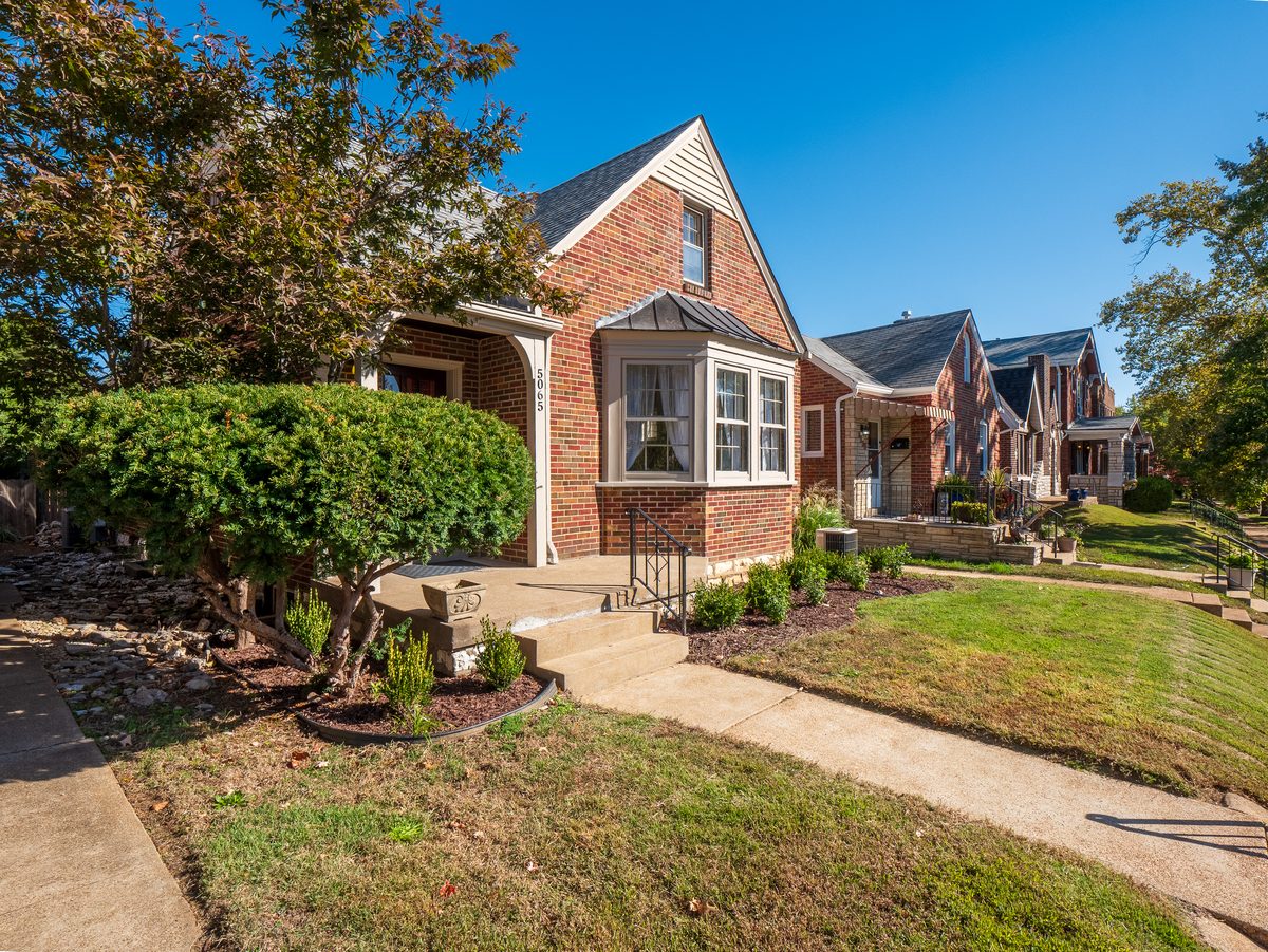 South City St. Louis homes for sale — 1.5-story brick with bay window and stone steps on Miami Street, the 1930s-40s housing stock buyers find across South City neighborhoods