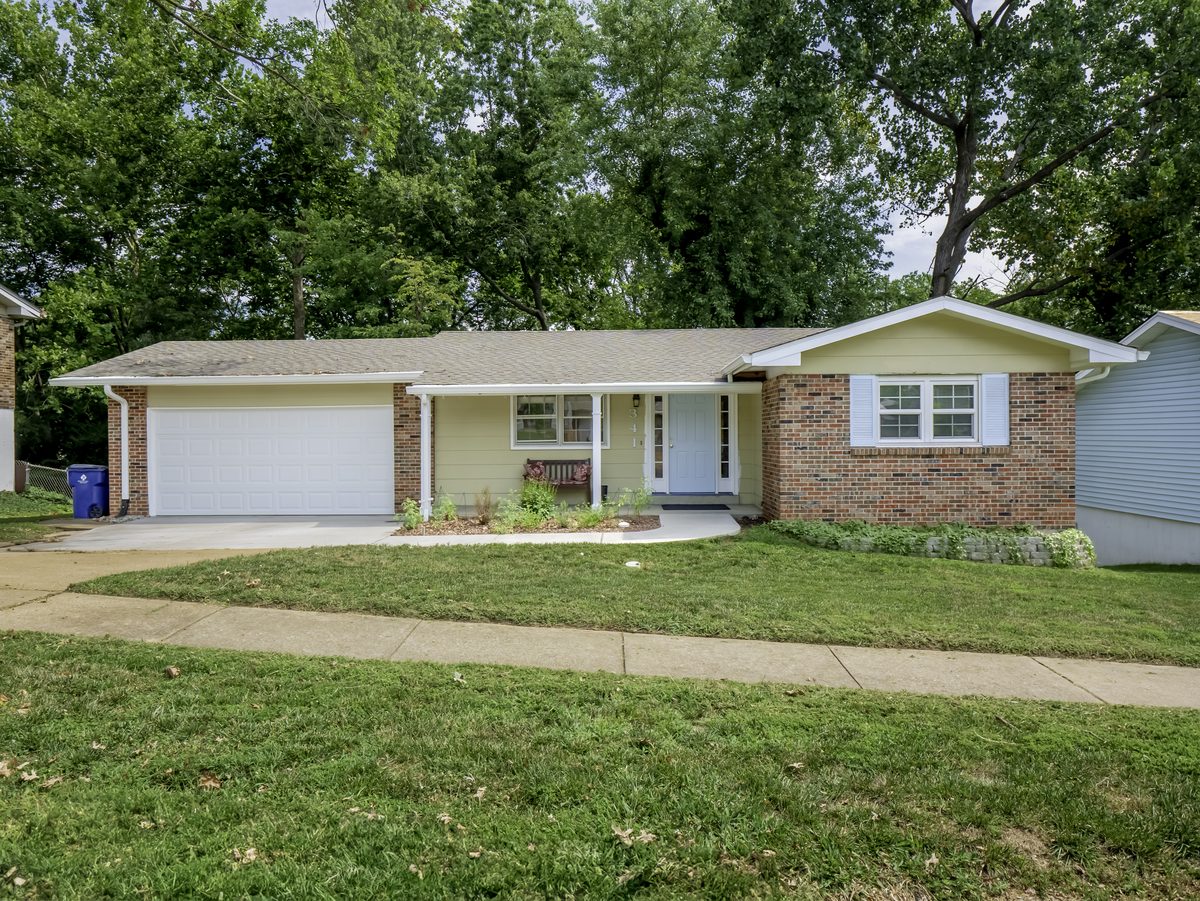 South County St. Louis homes for sale — updated brick and vinyl ranch with 2-car garage and large mature lot, move-in ready housing stock typical of South County St. Louis County
